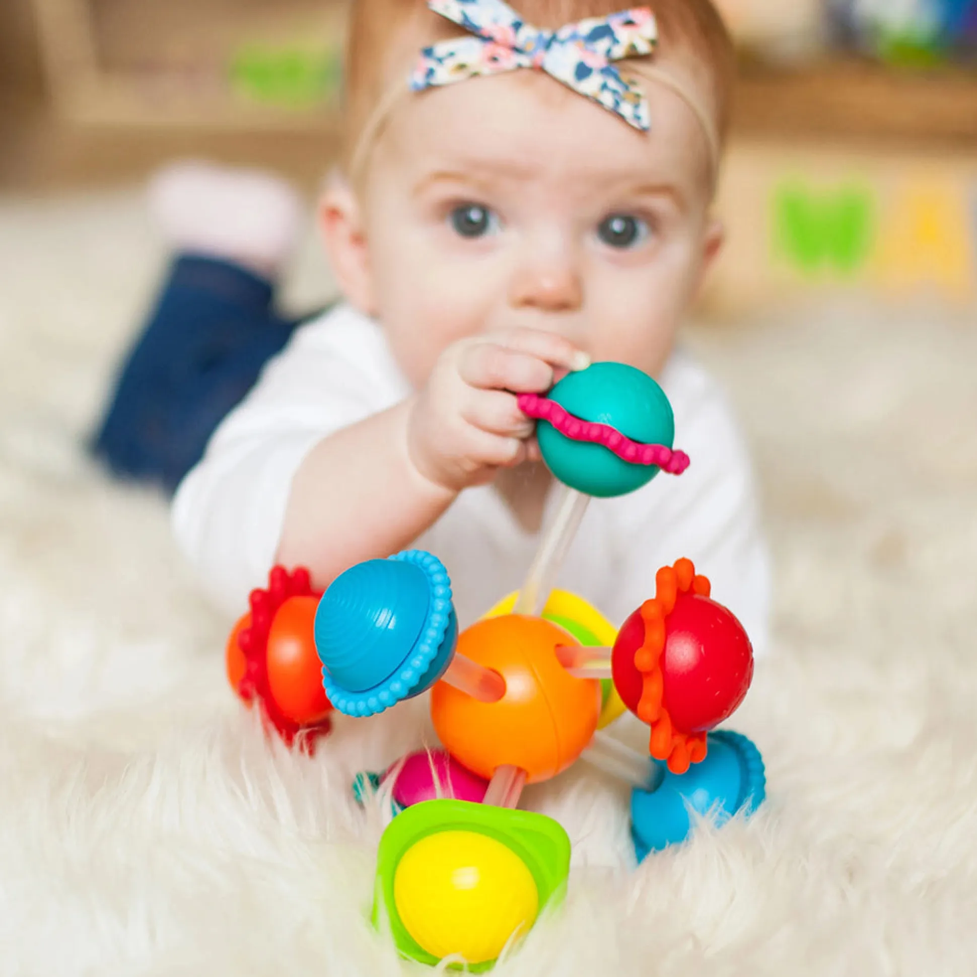 Wimzle Sensory Discovery Toy | Spinning Orbs & Silicone Rings