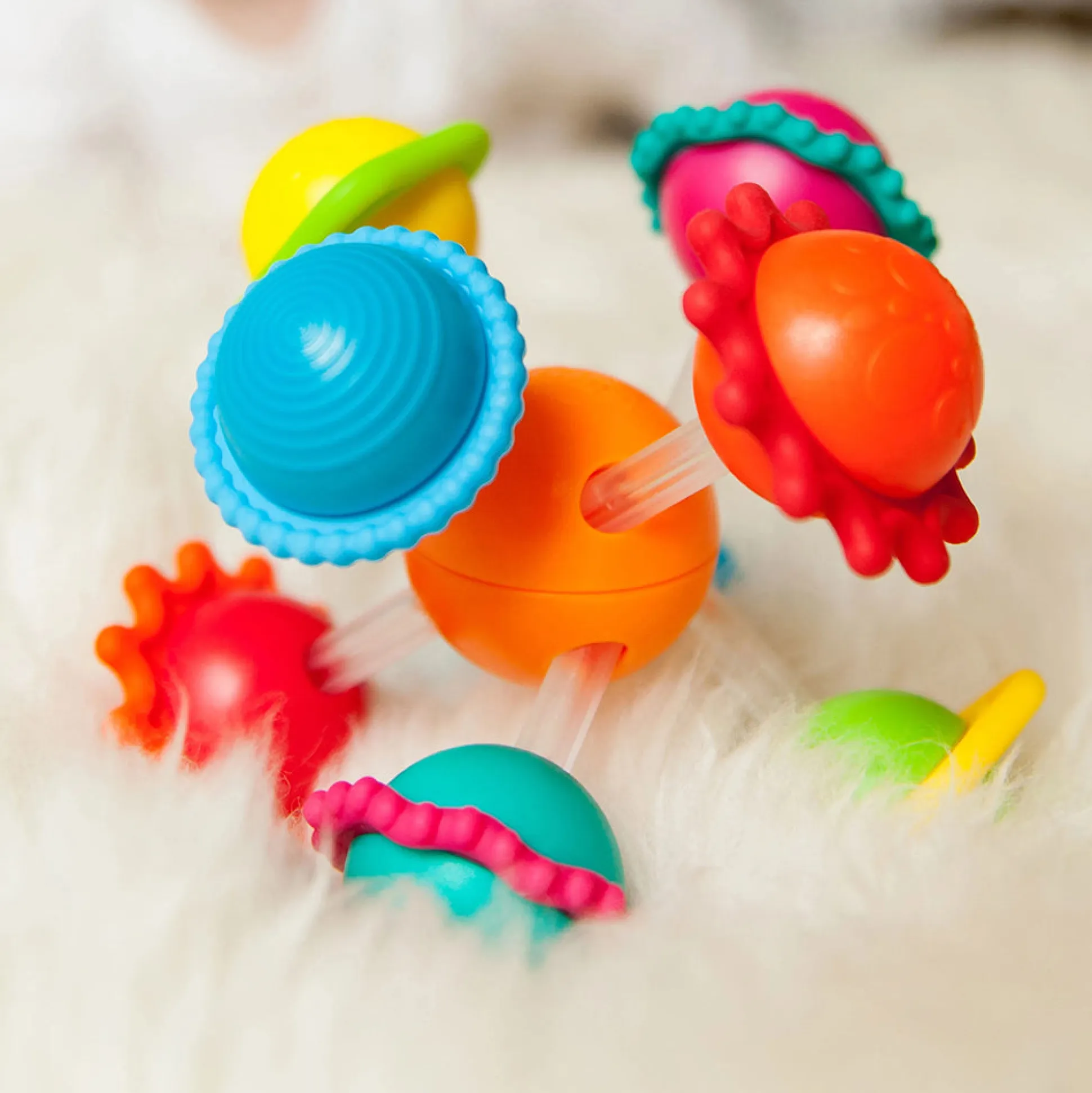 Wimzle Sensory Discovery Toy | Spinning Orbs & Silicone Rings